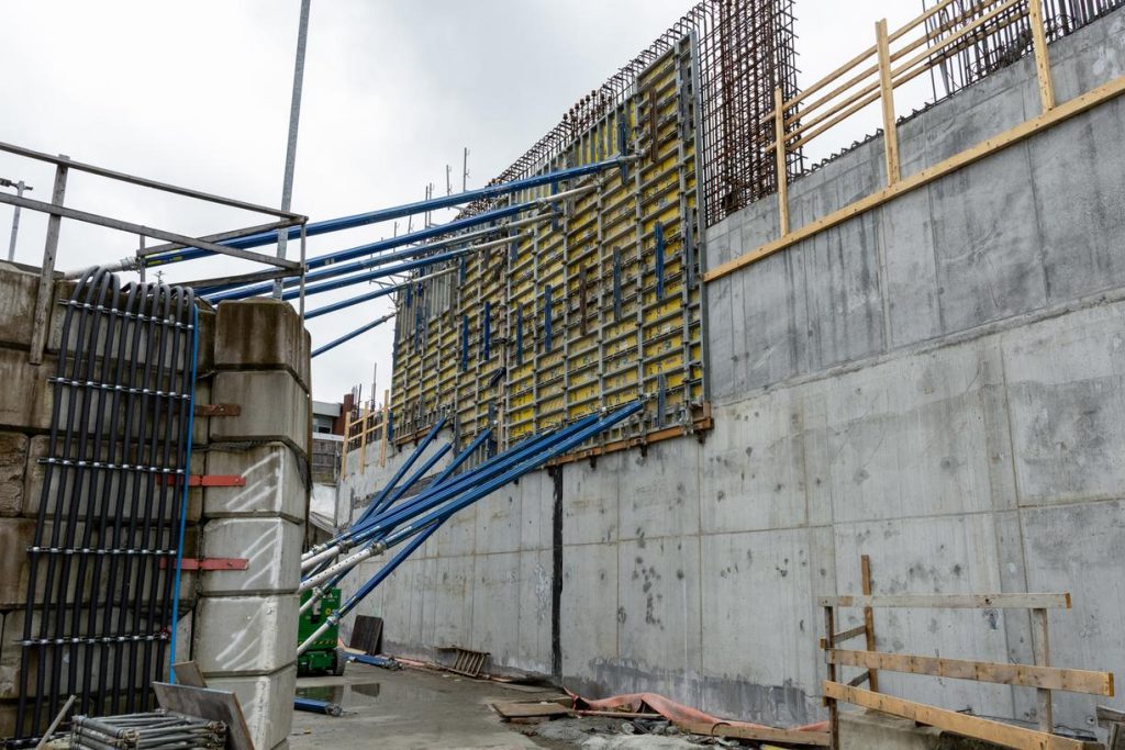 Crews construct the walls of the above-ground station entrance at Great Northern Way-Emily Carr.